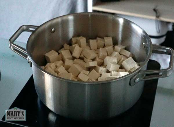 two pounds of cubed tofu in pot