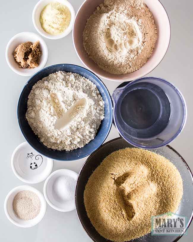 ingredients to make vegan keto sourdough: nutritional yeast, oat fiber, brown sugar, vital wheat gluten, water, liquid lactic acid, instant yeast, salt, ground flax seeds