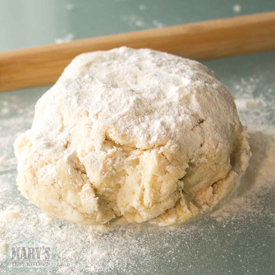 mound of vegan croissant dough dusted with flour