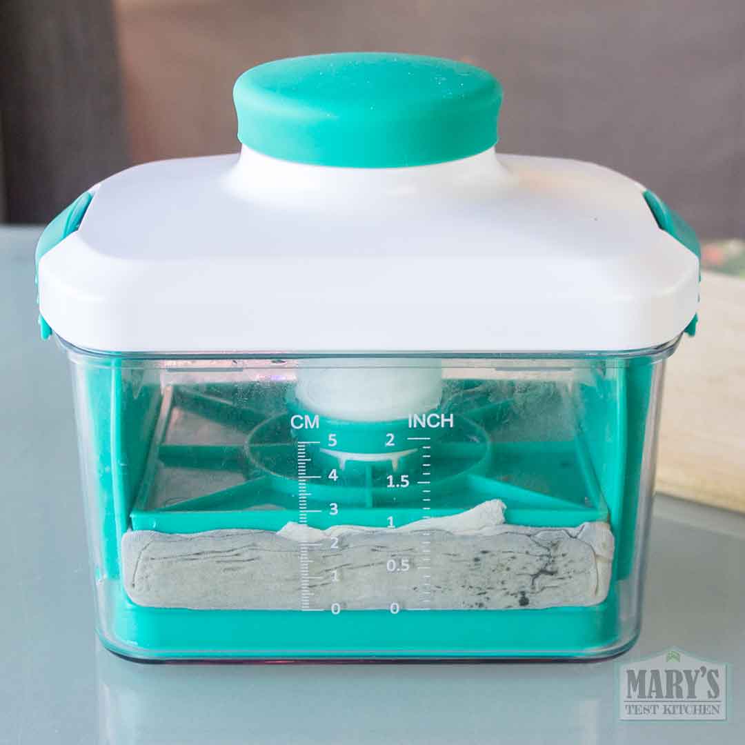 pressing black sesame curds