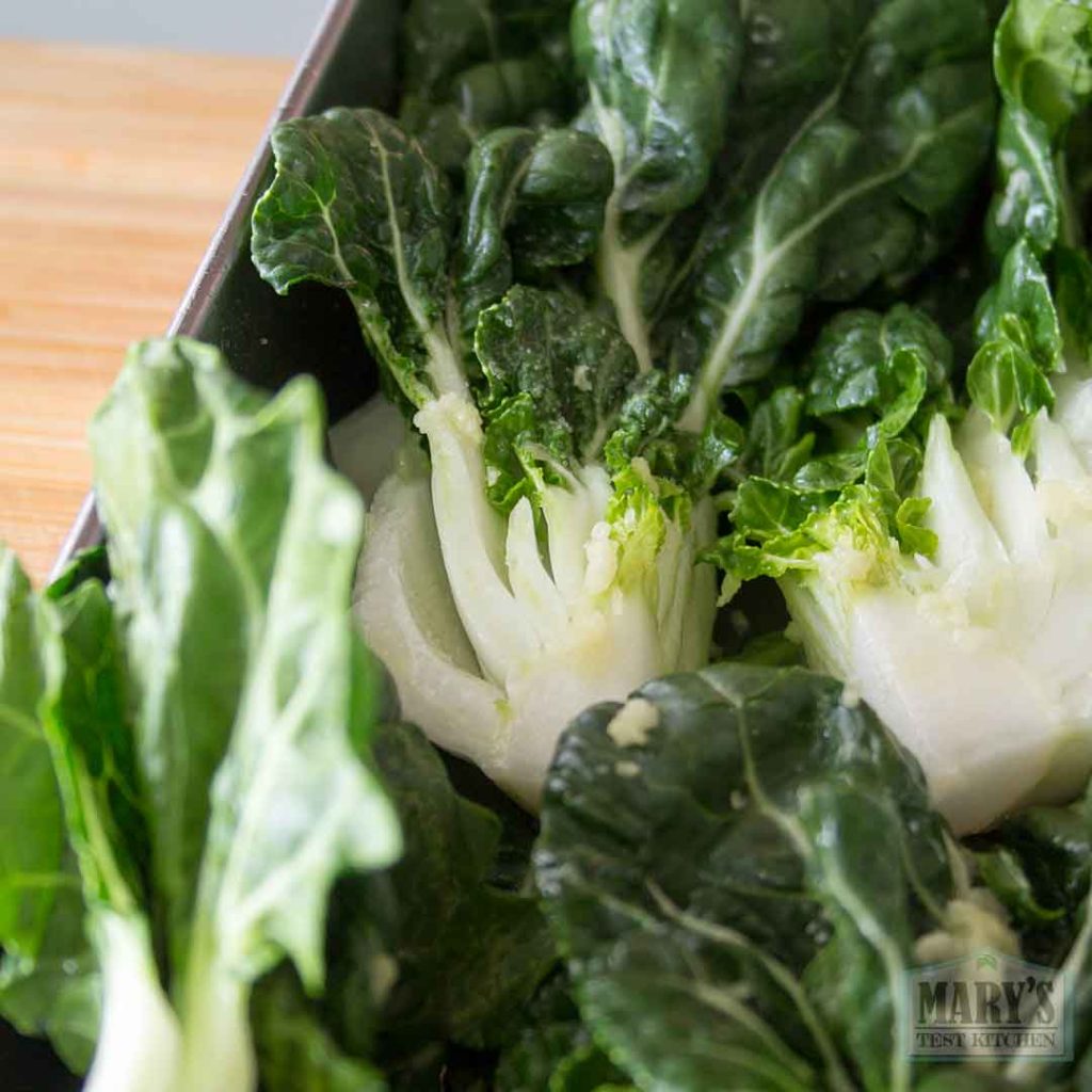 bok choy cross sections seasoned with oil, garlic and salt
