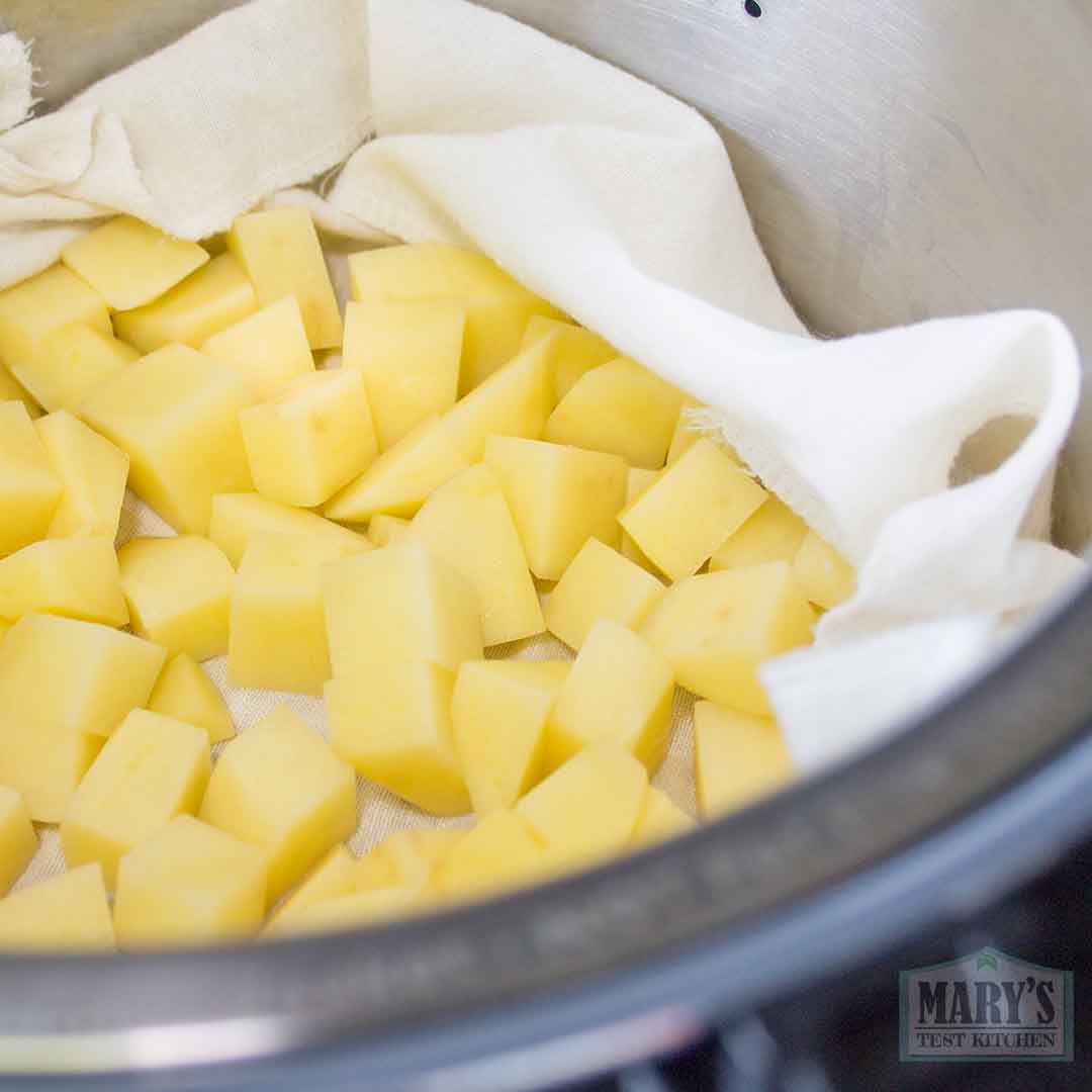 cubed potatoes in steaming basket